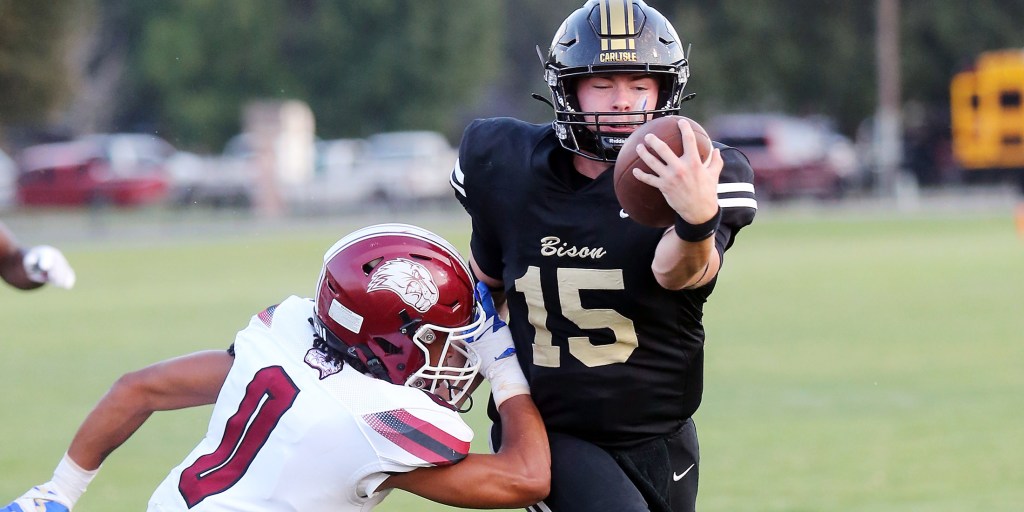 Carlisle quarterback Baylor Hauk scores a touchdown during the Bison’s loss to Lake Village on Friday night. Photo: Mark Buffalo