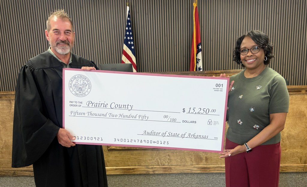 Prairie County District Court Judge Eric Kennedy and Prairie County Clerk and Circuit Clerk Gaylon Hale pose with a presentation check for a state grant used to improve security at the District Court courtroom in Hazen. Photos: Prairie County District Court